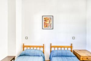 Posteľ alebo postele v izbe v ubytovaní Villa La Flor con piscina
