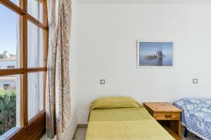 Posteľ alebo postele v izbe v ubytovaní Villa La Flor con piscina