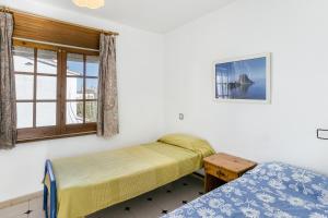 Posteľ alebo postele v izbe v ubytovaní Villa La Flor con piscina + 24 fotografií