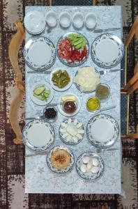 a table with plates of food on a table at Issa's House in Bayt Sāḩūr +6 photos