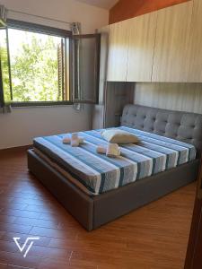 a bedroom with a large bed in a room at Villa Tico in Custonaci