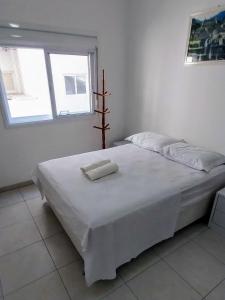 Кровать или кровати в номере Espaçoso aconchegante