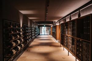 a hallway of wine racks in a wine cellar at Schloss Gamlitz in Gamlitz