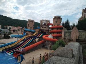 a water slide at a water park with people playing at апартамент на к.к Елените in Elenite