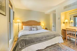 a bedroom with a large bed with white sheets and pillows at Seventh Mountain Condo with Resort Amenities! in Bend