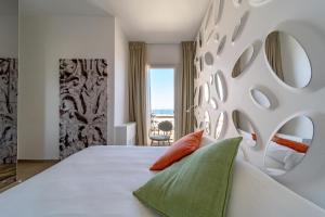 a bedroom with a large white bed with two pillows at Xilhotel in Gallipoli