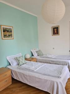 Ένα ή περισσότερα κρεβάτια σε δωμάτιο στο JR's House