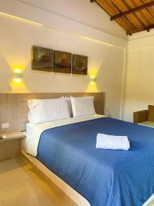 Postel nebo postele na pokoji v ubytování Senderos del Mar - Tayrona