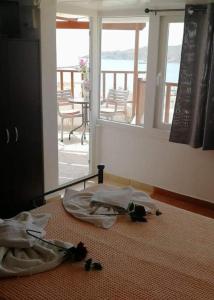 a room with two bags on the floor with a balcony at Diana in Ermoupoli