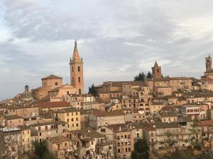 a town on a hill with houses and a church at B&B Casa di Carla in Ripatransone
