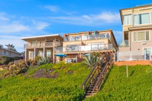 a large house on top of a hill at 3009 Ocean Street in Carlsbad