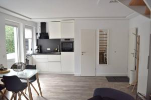 Kuchyň nebo kuchyňský kout v ubytování Schönes Apartment (Nr. 9) über 2 Etagen + 9 fotografií