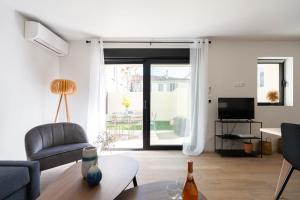 Televízia a/alebo spoločenská miestnosť v ubytovaní La Maison du Parc I Standing 3 chambres 8 pers Parking Clim Wifi Vélodrome