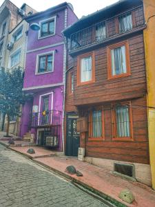 a row of houses on a street in a city at Taksim History Wooden Hostel in Istanbul