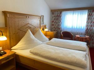 Postel nebo postele na pokoji v ubytování Seehotel Schäpfle