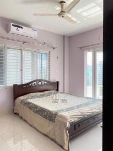 Ένα ή περισσότερα κρεβάτια σε δωμάτιο στο 4 Beds Condo Holiday Home at Bashundhara Dhaka