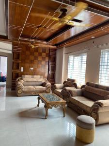 a large living room with couches and a coffee table at 4 Beds Condo Holiday Home at Bashundhara Dhaka in Dhaka