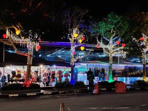 a christmas display in front of a building with lights at zarraz homestay The Retreat Nova Kea Farm Brinchang in Brinchang