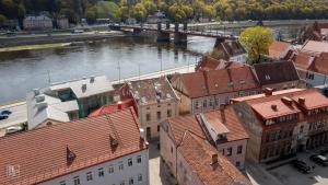 an aerial view of a city with a river and buildings at Cozy Old Town apartment in Kaunas
