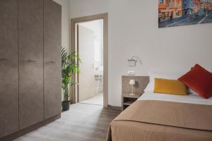 Postel nebo postele na pokoji v ubytování Nido Suite & Apartments