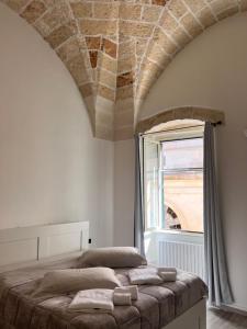 Ένα ή περισσότερα κρεβάτια σε δωμάτιο στο Holiday House Signuria