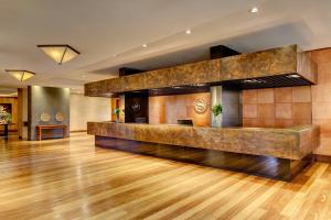 a lobby of a hotel with a reception desk at Sheraton Colonia Golf & Spa Resort in Colonia del Sacramento