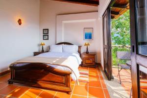 Postel nebo postele na pokoji v ubytování Acaima Café Lodge