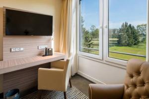 TV o dispositivi per l'intrattenimento presso Balland's Hotel & Restaurant