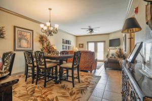 a living room with a dining room table and chairs at MVC - Unit 2507 in Pigeon Forge