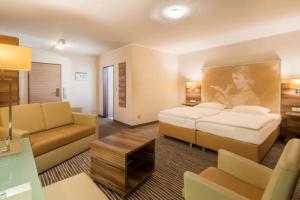 Letto o letti in una camera di Balland's Hotel & Restaurant