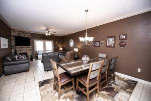 a dining room and living room with a table and chairs at MVC - Unit 3301 - Making Memories in Pigeon Forge