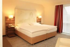 Letto o letti in una camera di Balland's Hotel & Restaurant