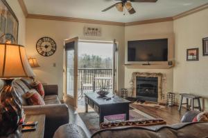 a living room with a couch and a fireplace at MVC - Unit 3207 - Happy Place in Pigeon Forge