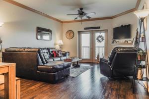 a living room with a leather couch and chairs at MVC - Unit 5707 - Hawks Nest in Pigeon Forge
