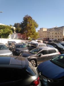 a bunch of cars parked in a parking lot at riad zahra in Fès