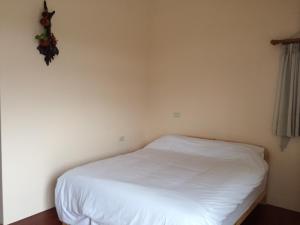 Postel nebo postele na pokoji v ubytování Dragon House B&B