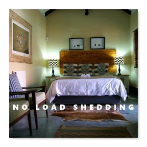 Säng eller sängar i ett rum på Khayamanzi Guesthouse