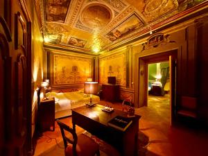 a bedroom with a bed and a table in a room at Casa Santangelo Suites in Salerno