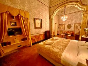 a bedroom with a large bed in a room at Casa Santangelo Suites in Salerno