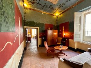 a living room with a table and a couch at Casa Santangelo Suites in Salerno