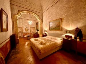 a bedroom with a large bed in a room at Casa Santangelo Suites in Salerno