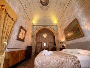 a bedroom with a large bed in a room at Casa Santangelo Suites in Salerno