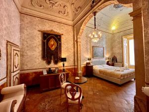 Posteľ alebo postele v izbe v ubytovaní Casa Santangelo Suites