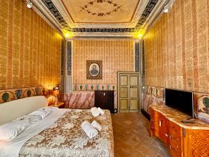 Televízia a/alebo spoločenská miestnosť v ubytovaní Casa Santangelo Suites