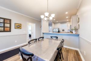 a kitchen and dining room with a table and chairs at The Tides -- 20007 Sandy Bottom # 4202 in Rehoboth Beach