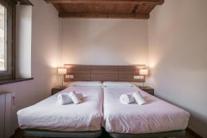 Posteľ alebo postele v izbe v ubytovaní Apartamentos SNÖ Mont Romies Unhola
