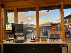 a kitchen with a window with a view of the mountains at Blue Door Inn in Estes Park