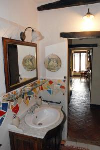 a bathroom with a sink and a mirror at CASALE SPOLETO in Spoleto