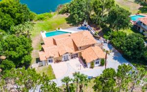 an aerial view of a house with a swimming pool at SWISS 65 - Lake Denise in Clermont