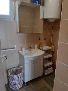 a bathroom with a sink and a mirror at 4 you in Nin +32 photos